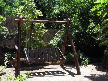 Swinging chair in the garden