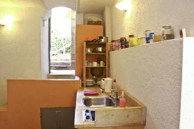 Entrance door, a few steps to the living and kitchen area