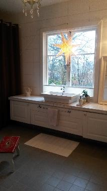 Bathroom with bathtub and sauna