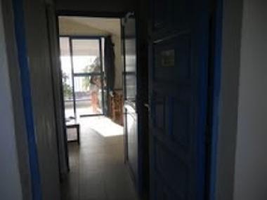 Studio seen from the entrance door: bunk beds and bathroom left and right, then main room, then terr