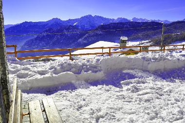 private garden in winter: top for children discovering a new world: the snow!