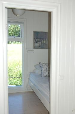 Double bed seen from living room
