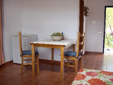 kitchen with gas stove, refrigerator,enough space to sit outside
