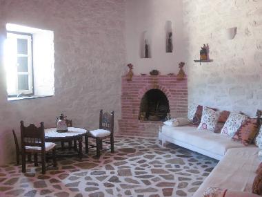 the sitting room with the fireplace