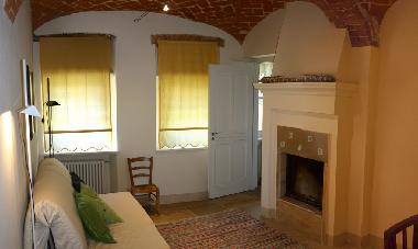The third bedroom with queen size folding bed and fireplace