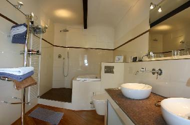 The bathroom on first floor: bathtub and shower