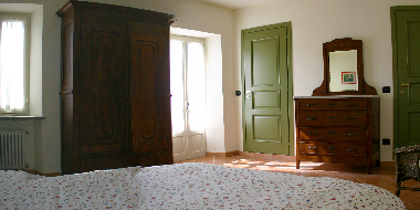 The sec ond master bedroom. The windows-door on the left leads to the balcony. The grreen door in fr