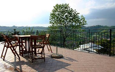 The terrace faces North: the village of Cisterna is on the hill in front of the house