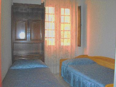 the room with single beds: the window