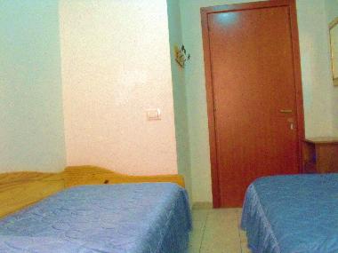 the room with single beds: the entry