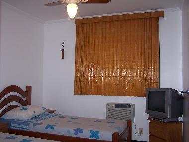 second bedroom with two (2) single beds