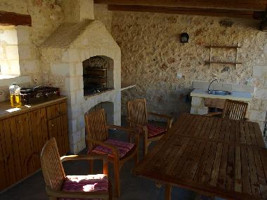 out Door Kitchen - we cook with gas on a traditional old Cretan flame cooker or gently with Balsbalg