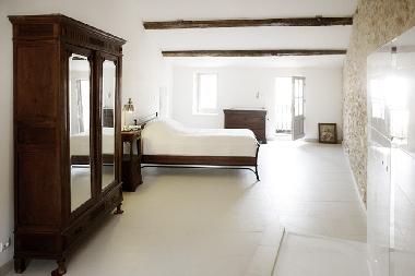 This is the master bedroom with its private shower (picture taken before it was ready) and a zink