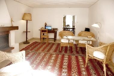 The lounge inside the house and you see the kitchen at the rear end.