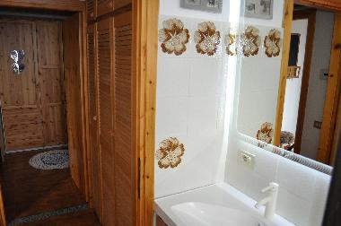 the bathroom and the bedroom on the background