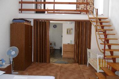 Bedroom with a gallery