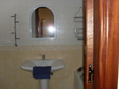 Bathroom has bath/showerr, basin , bidet , toilet and storage 