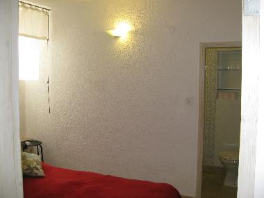Bedroom with door to Bathroom