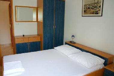 bedroom with double bed and big terrase