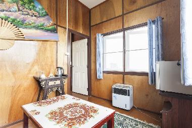 Seating area with sofa-bed and mini fridge