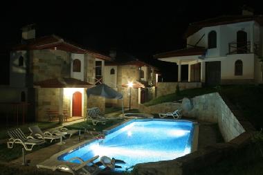 The Chalets and Pool at night