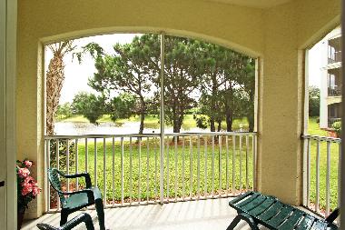 The garden, lake and fountain view from our screened balcony