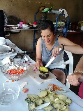 A guest enjoying the experience of making her own breakfast.