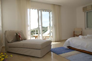 First floor large double bedroom with En Suite bathroom and shared sunbathing balcony