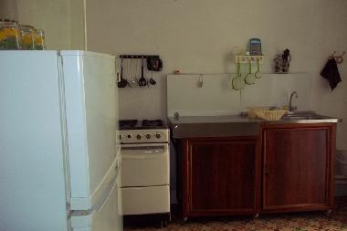 Kitchenette with range oven and fridge