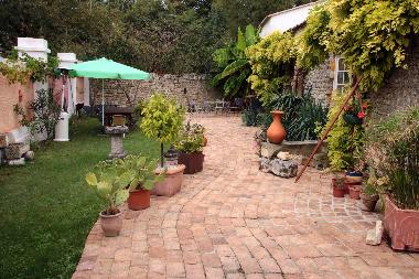 walled garden with furniture, space heater & BBQ