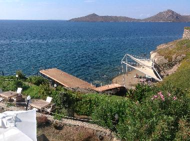 pier and areas seafront with sunbeds and umbrellas 