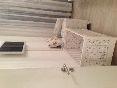 Part of bedroom with small bed f�r baby