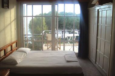 Double bed from No. 8 room. While you are lying, you can enjoy the wonderful view over the bay!