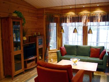 Living room has bay windows facing the lake