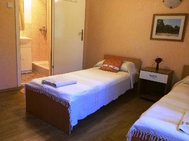 Twin bedroom with private bathroom.