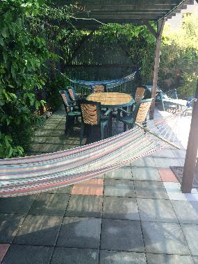 Pool area with Hammocks and dining area.