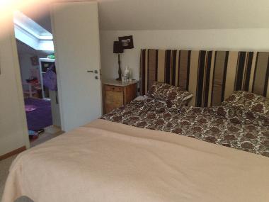 Big bedroom top floor with TV 