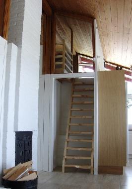 A staircase leads to the cozy loft where there is plenty of room