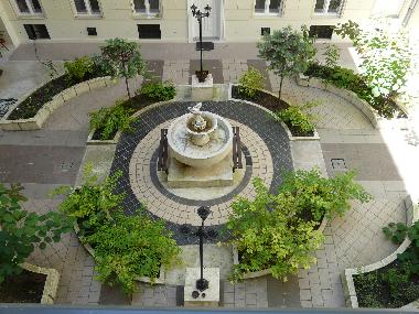 The fountain sorrounded by plants