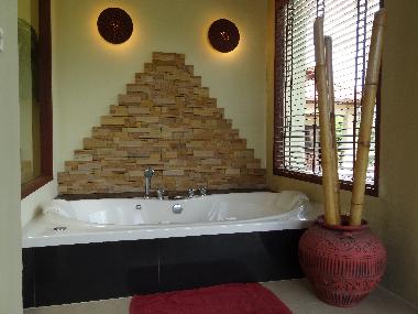 Relax in a 2-person Jacuzzi with views