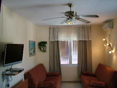 Livingroom with flat TV on wall