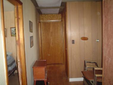Hall shown from bathroom end leading to bedrooms