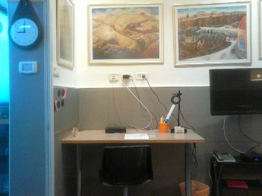 A working table, an home phone and a cable television