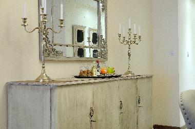 The Welcome plate with wine , fruits , delicasies 