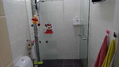 Bathroom with adjustable shower head for rain shower, power shower and more, all towels supplied