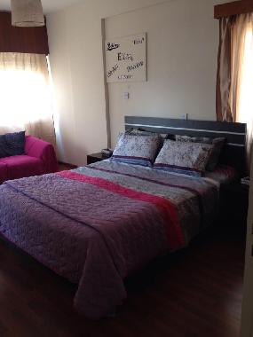 Master Bedroom with a sofa