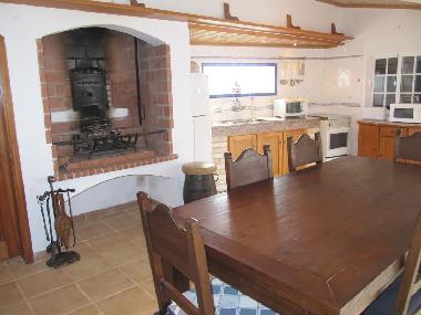Kitchen / diner with open fire and bread oven.