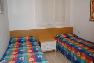 bedroom with 2 simple beds