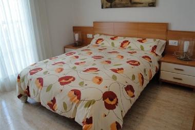 bedroom in suite with big bed, terrace and his own bathroom