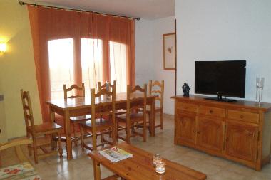 dining room with spanish tv